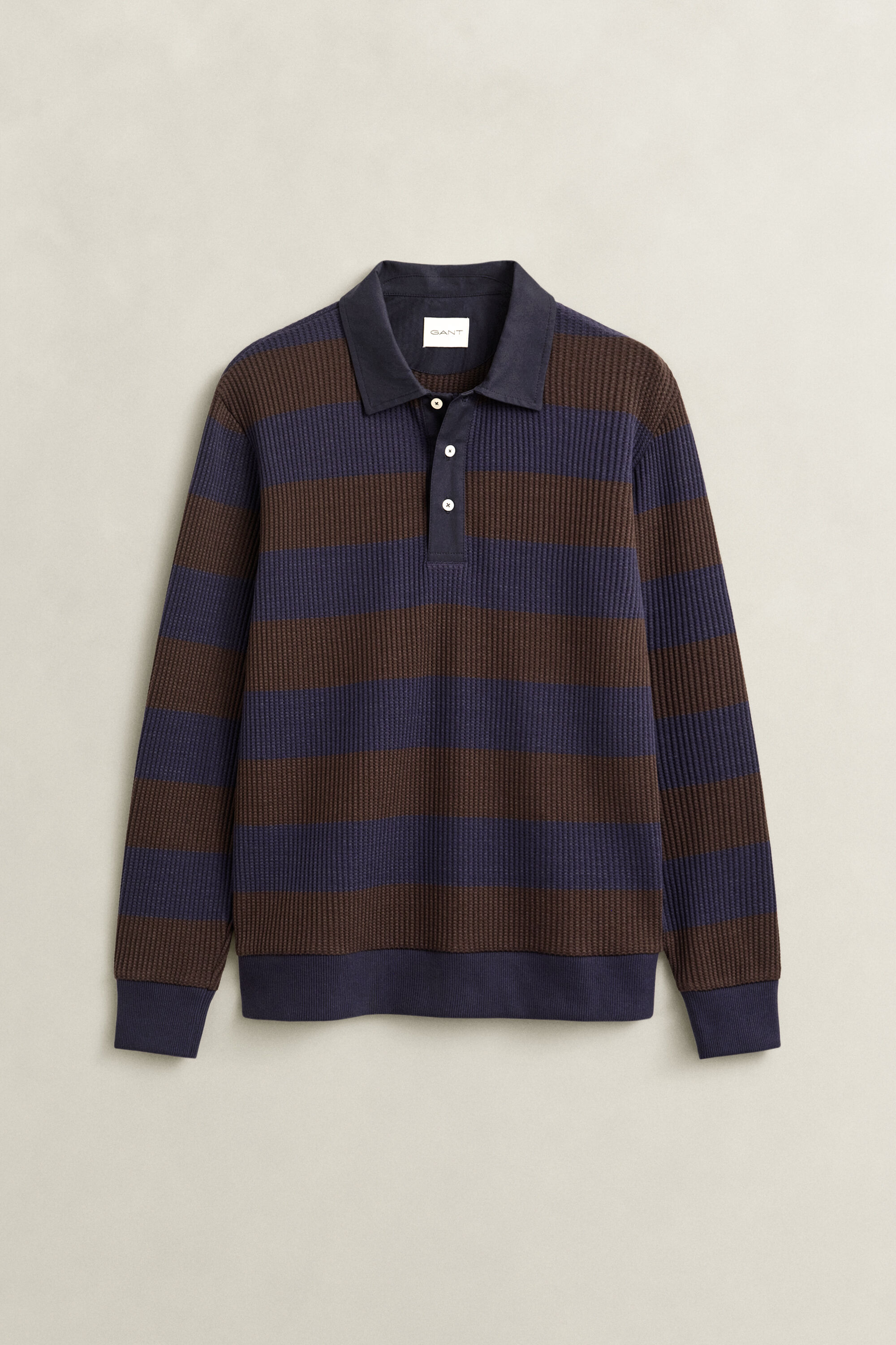 Polo com textura waffle às riscas