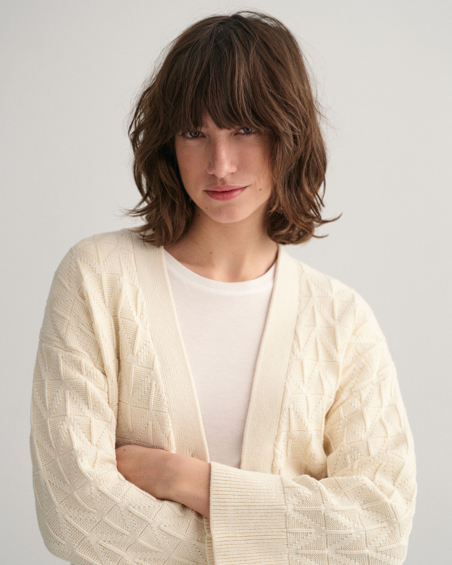 Casaco de malha com padr&atilde;o espinha de peixe e decote em V