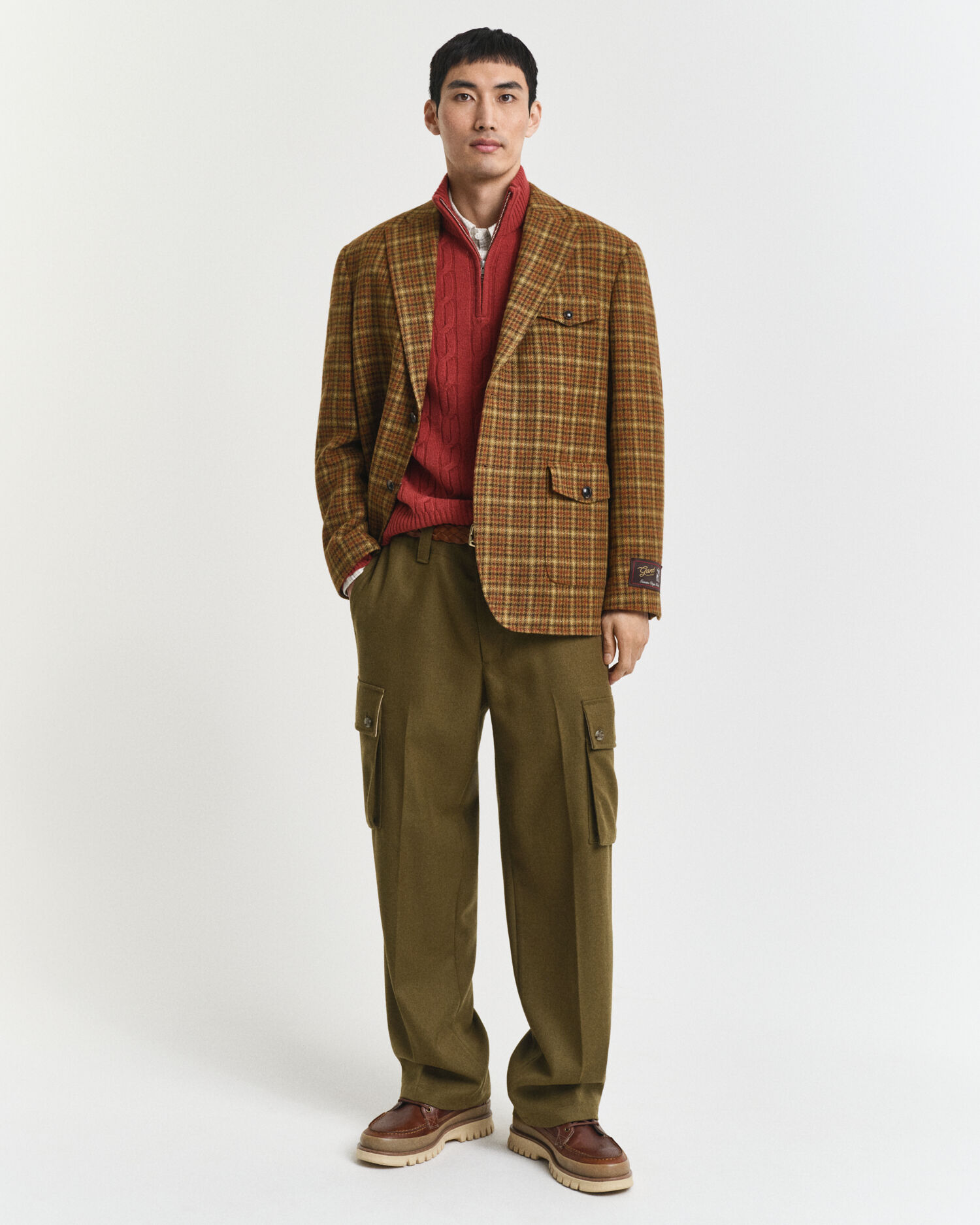 Camisola de malha entrançada com meio fecho de correr em lã