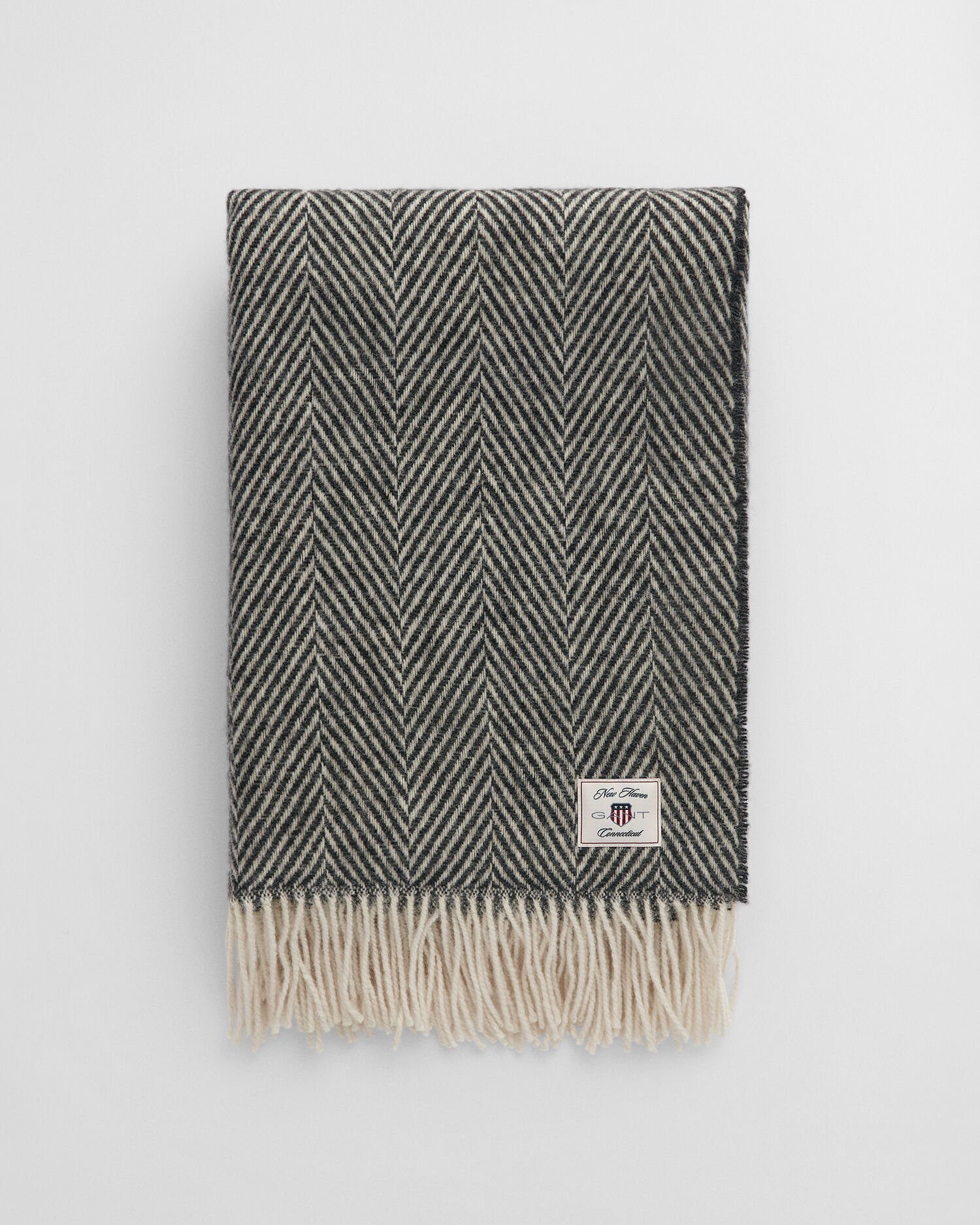 Manta decorativa em lã com padrão espinha de peixe