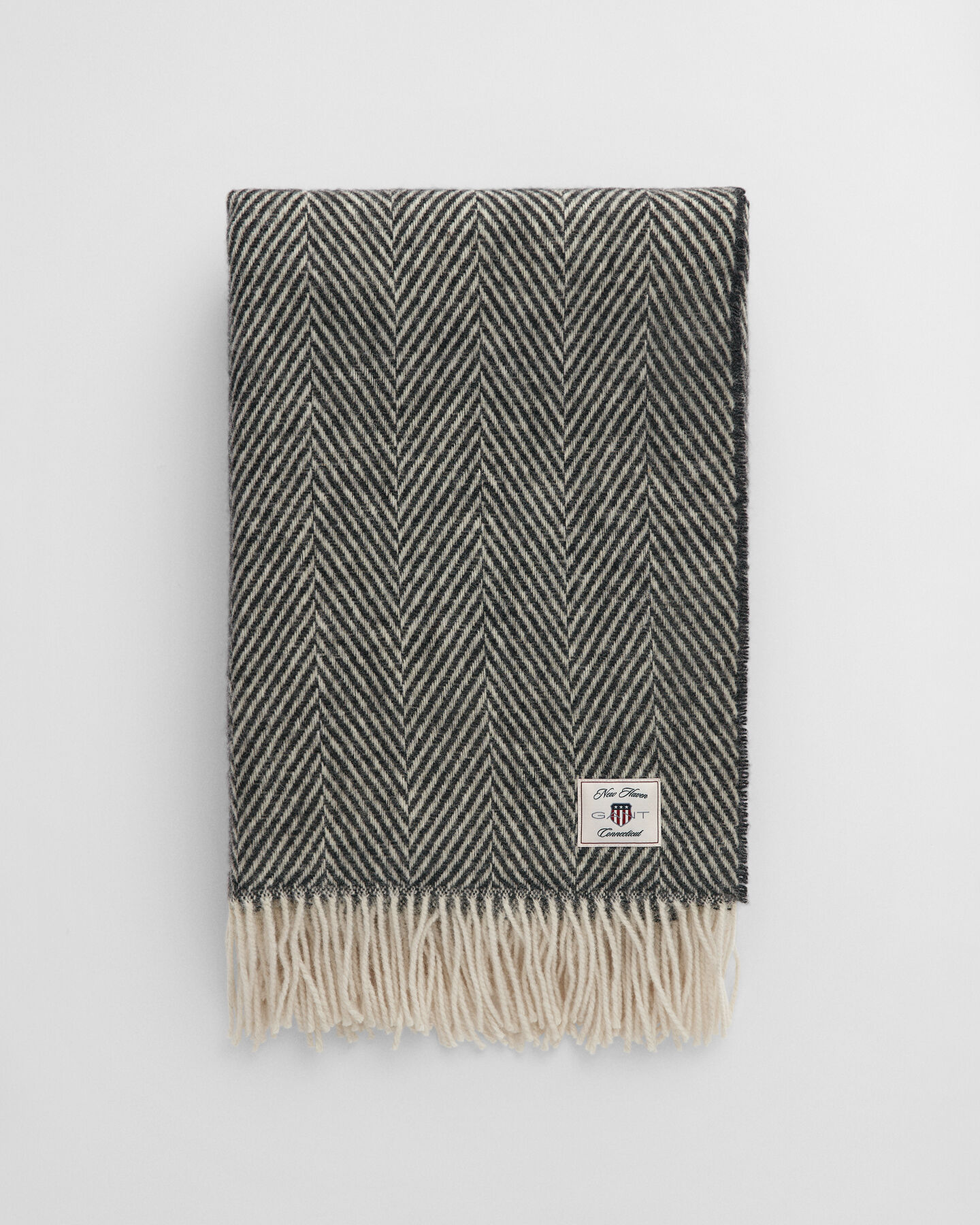 Manta decorativa em lã com padrão espinha de peixe