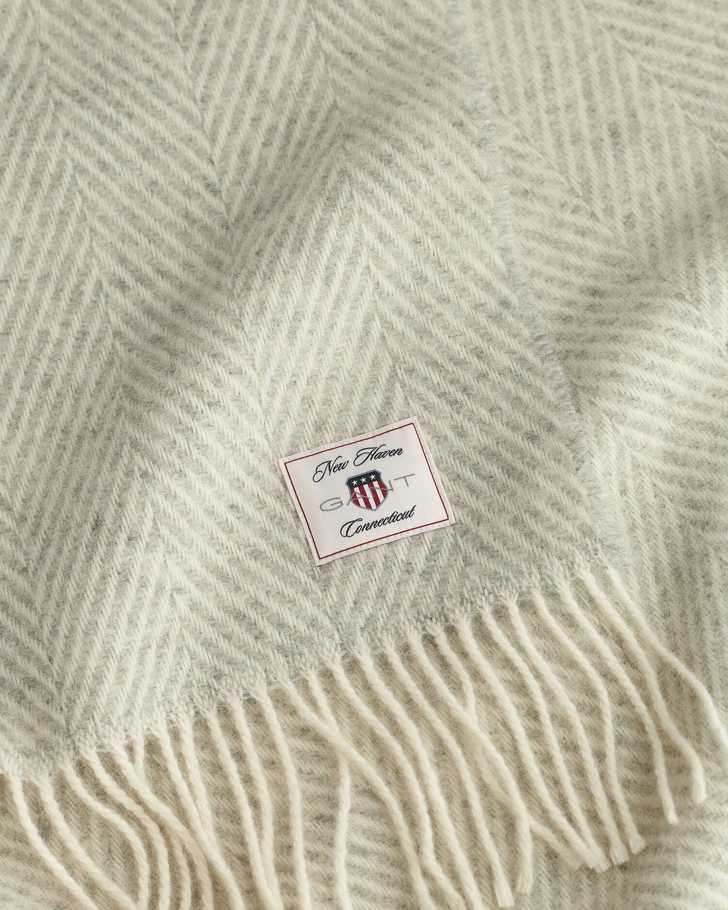 Manta decorativa em lã com padrão espinha de peixe