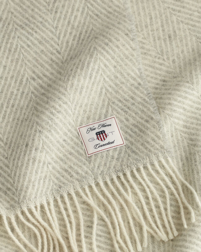 Manta decorativa em lã com padrão espinha de peixe