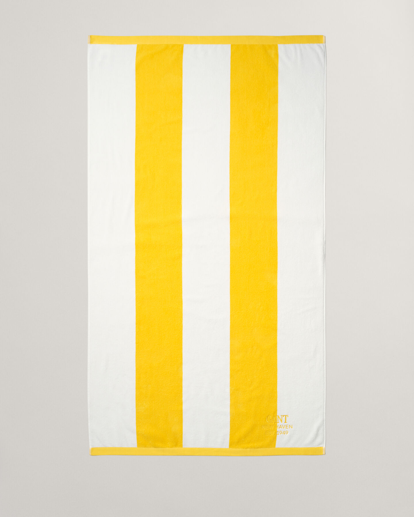 Toalha de praia às riscas arrojadas