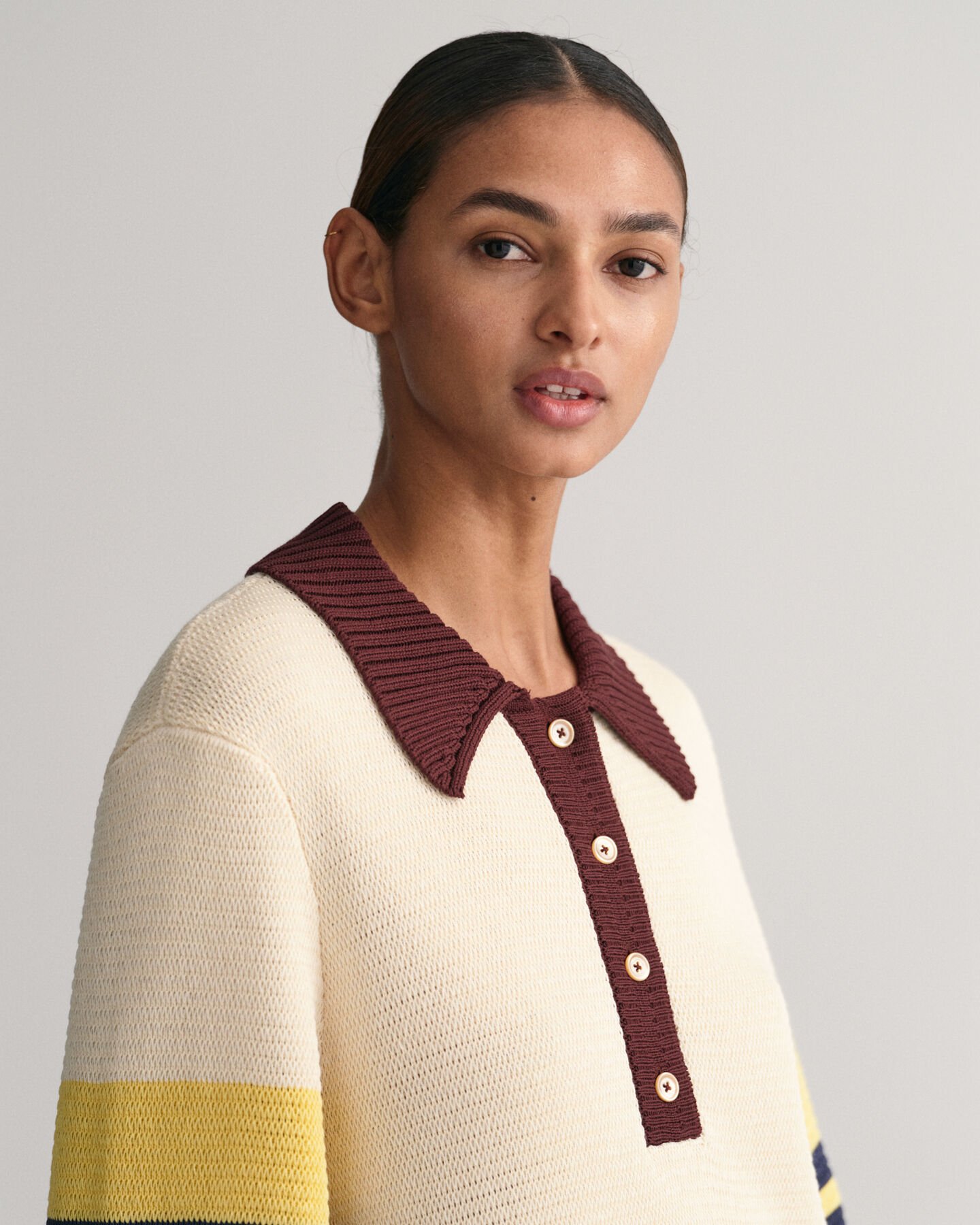 Polo em malha às riscas