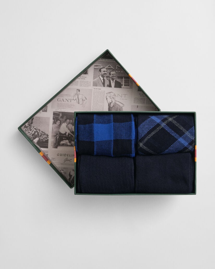 Caixa de presente com pack de quatro pares de meias com padrão de xadrez e lisas