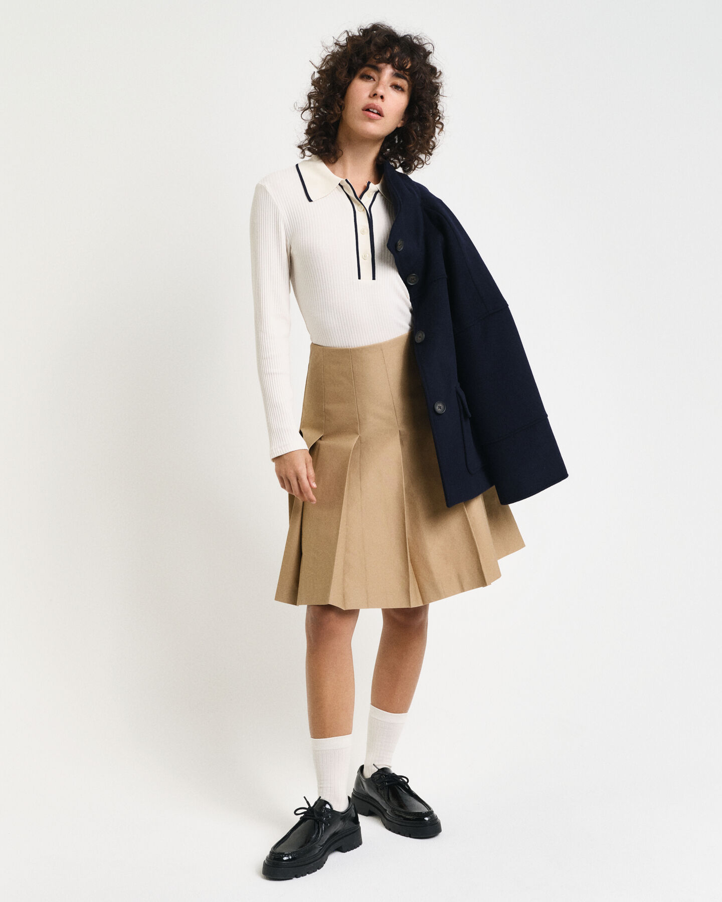 Polo de mangas compridas em malha canelada