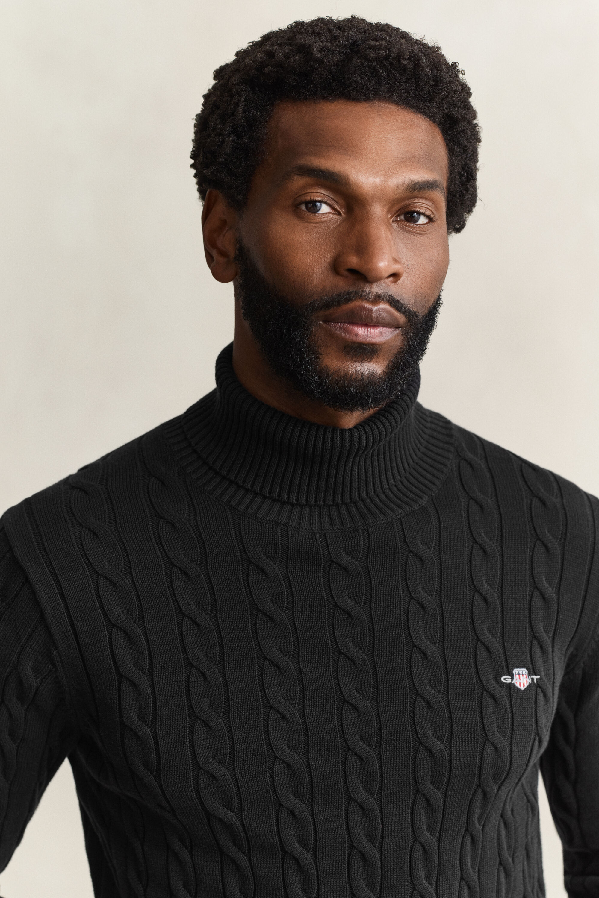 Camisola de gola alta em malha entrançada de algodão