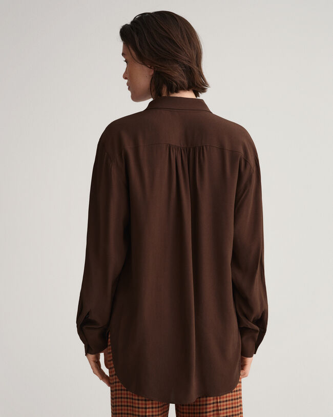 Camisa com la&ccedil;o