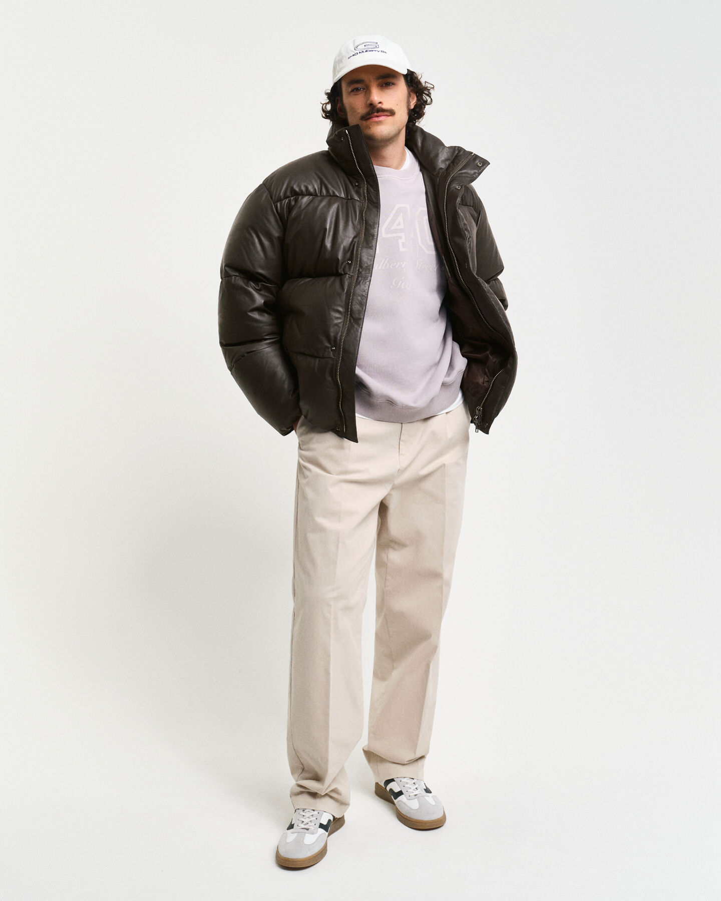 Blusão acolchoado em pele com penas de ganso