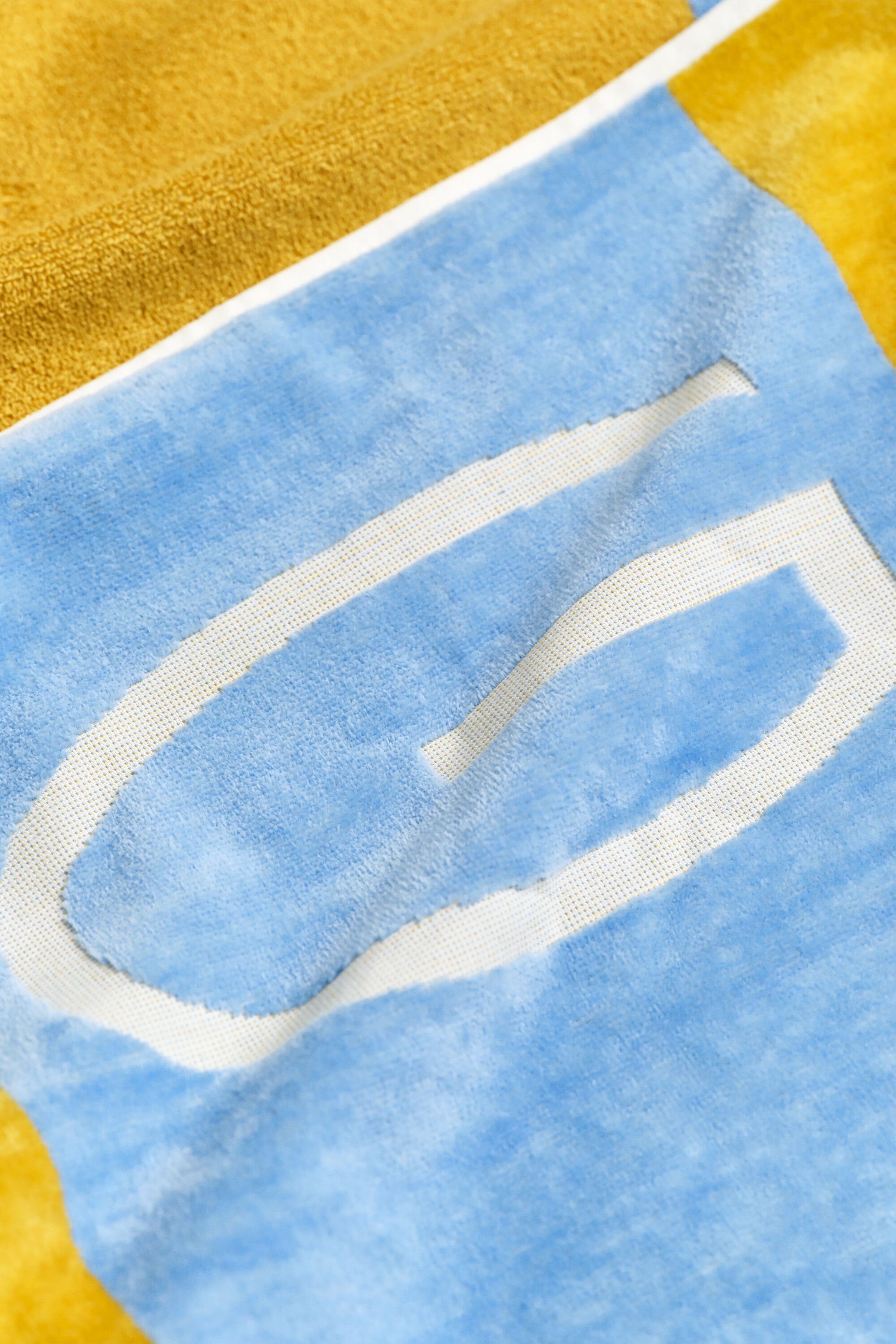 Toalha de praia às riscas em bloco