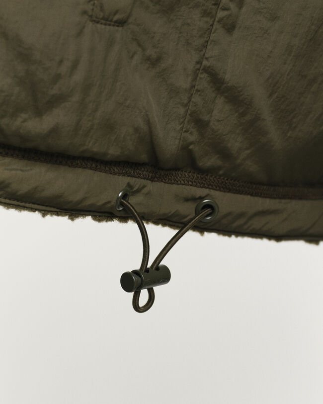 Polar reversível com fecho de correr