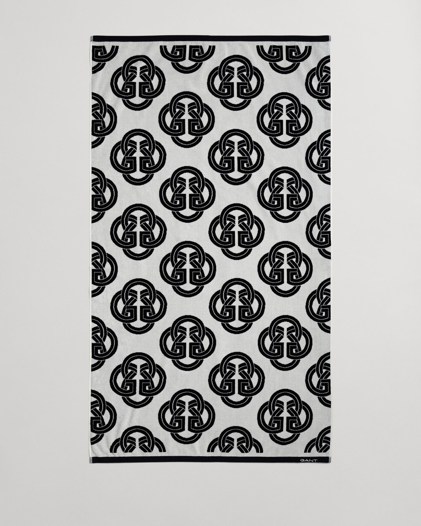 Toalha de praia com estampado Monogram