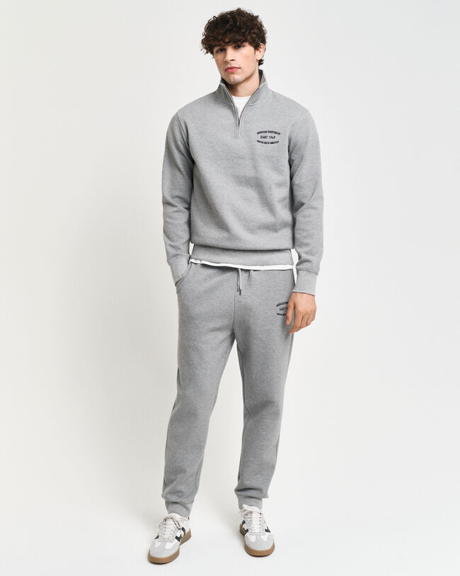 Calças desportivas com grafismo pequeno