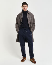 Calças desportivas com grafismo pequeno