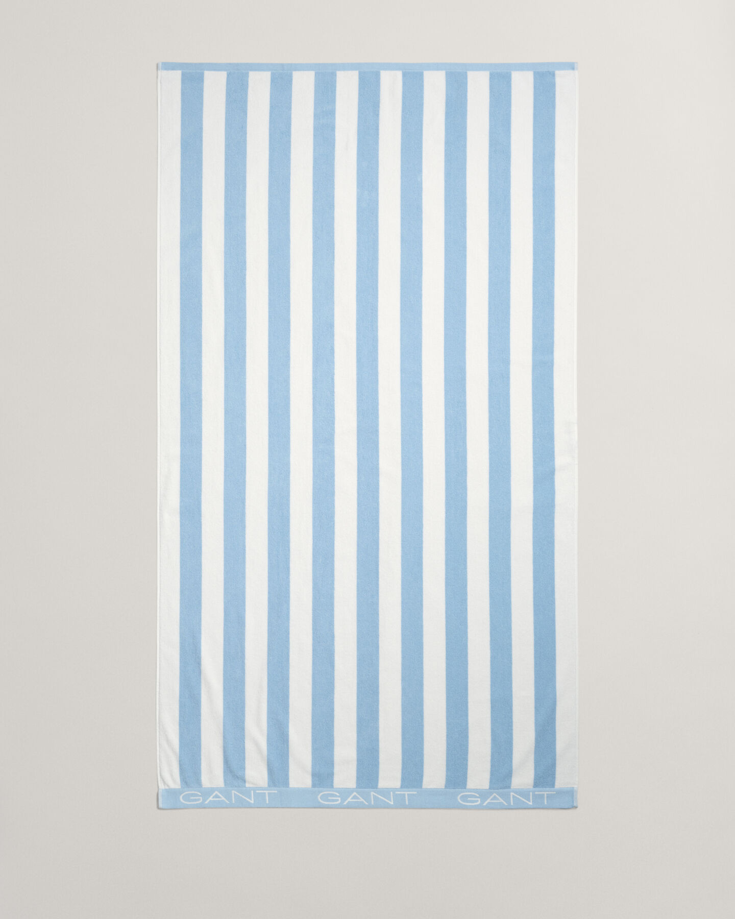 Toalha de praia às riscas em bloco