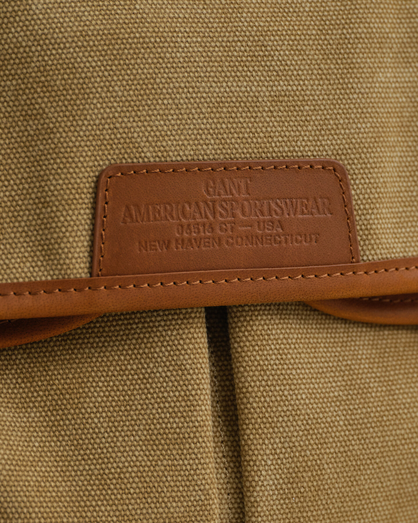 Mala em lona com efeito desgastado