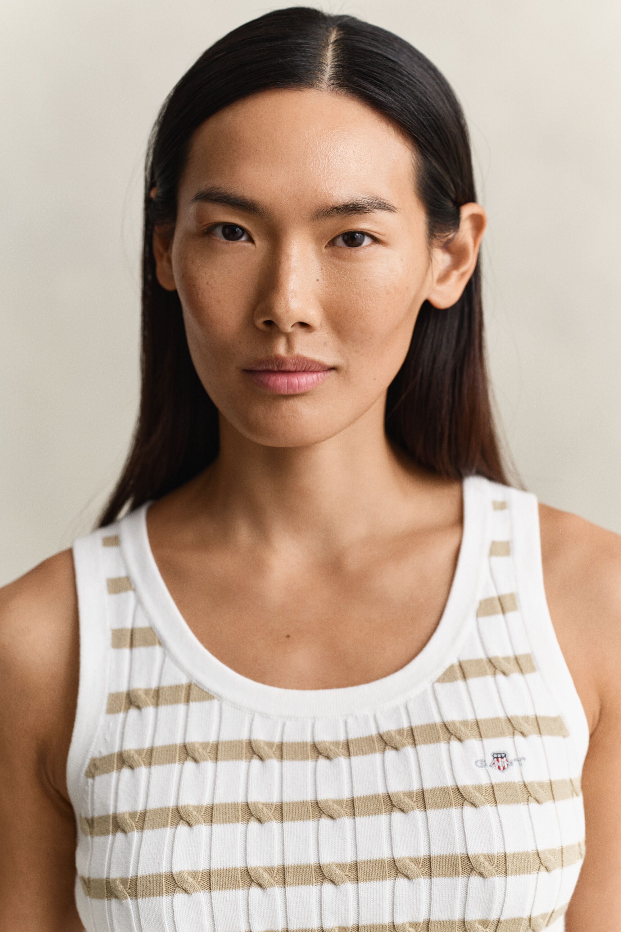 Camisola sem mangas em malha entrançada às riscas