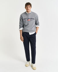 Calças afuniladas em sarja de algodão slim fit