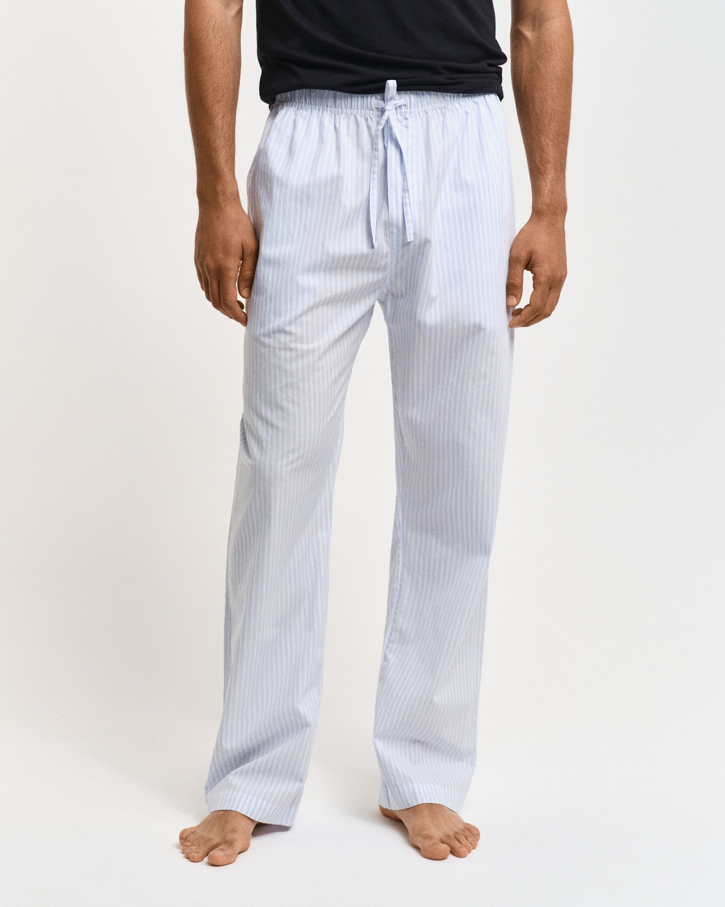 Calças de pijama às riscas