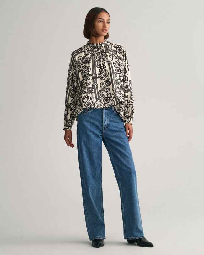 Blusa de gola alta com estampado de renda