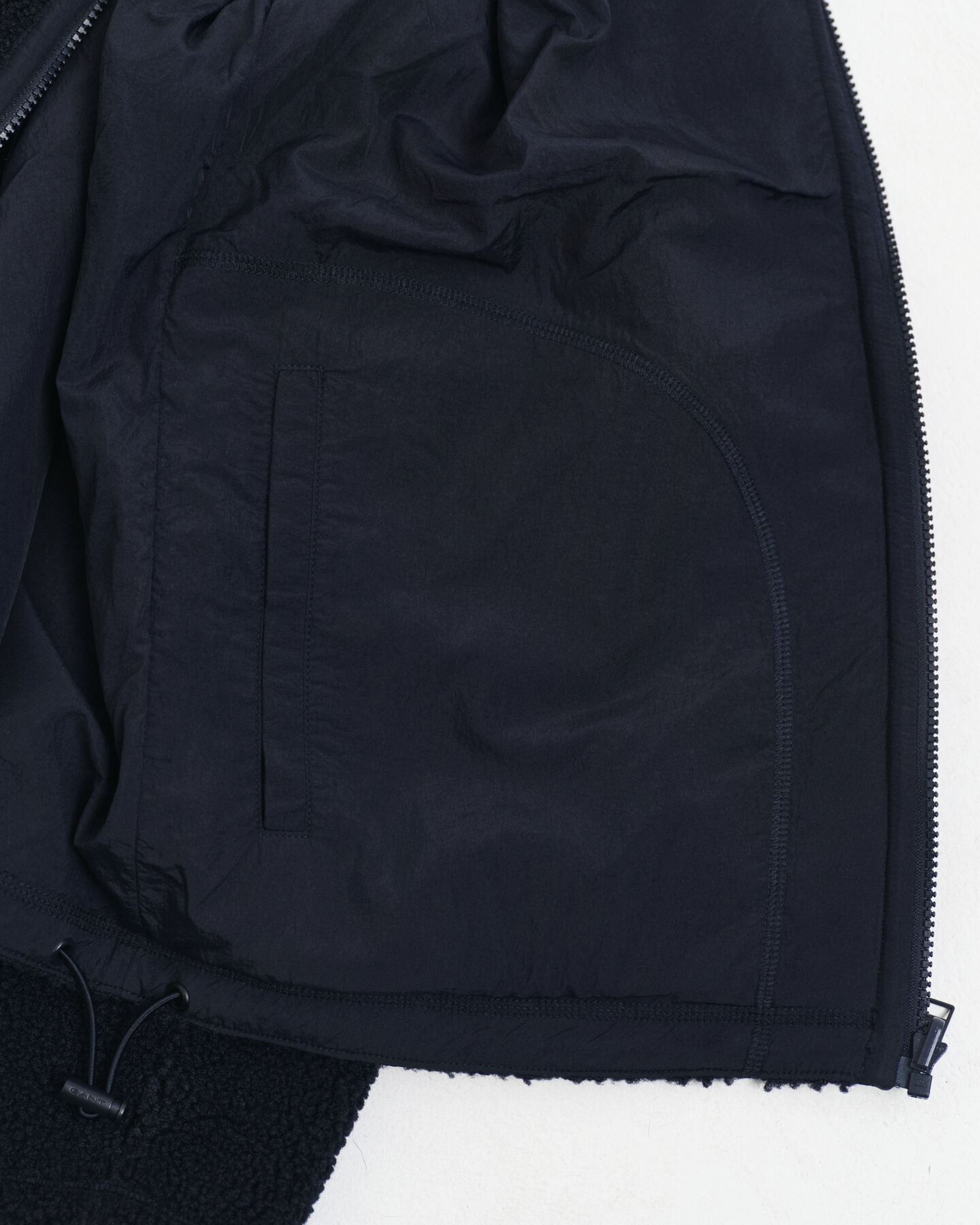 Polar reversível com fecho de correr