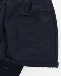 Polar reversível com fecho de correr