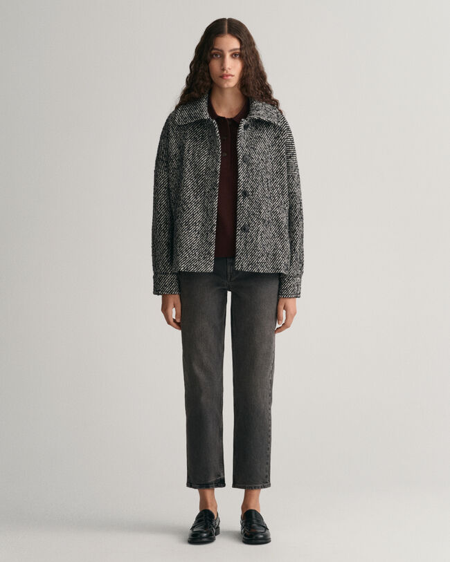 Calças de ganga pelo tornozelo com perna a direito