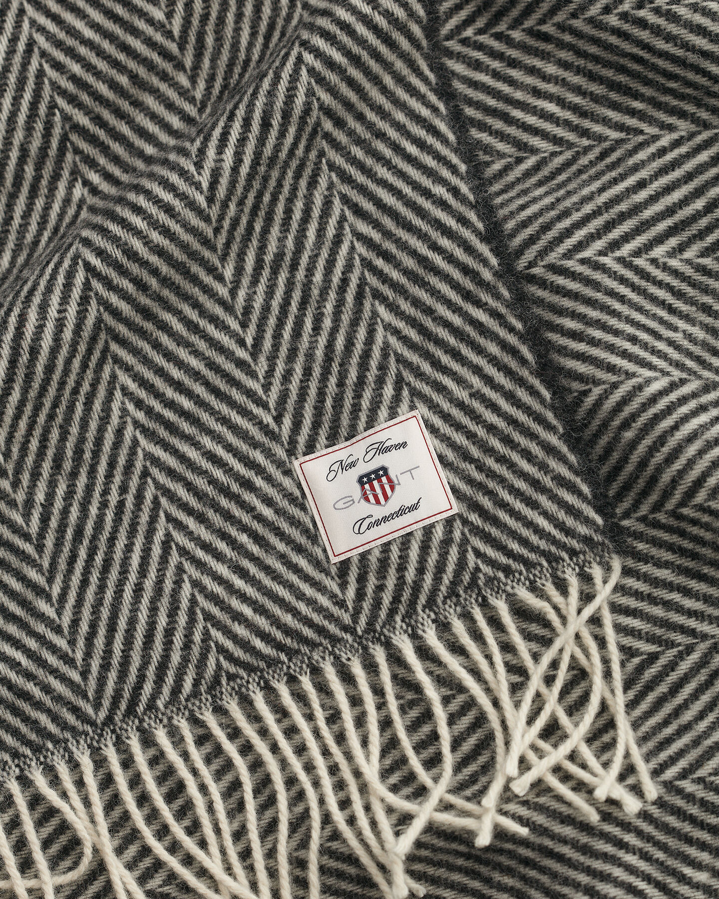 Manta decorativa em lã com padrão espinha de peixe