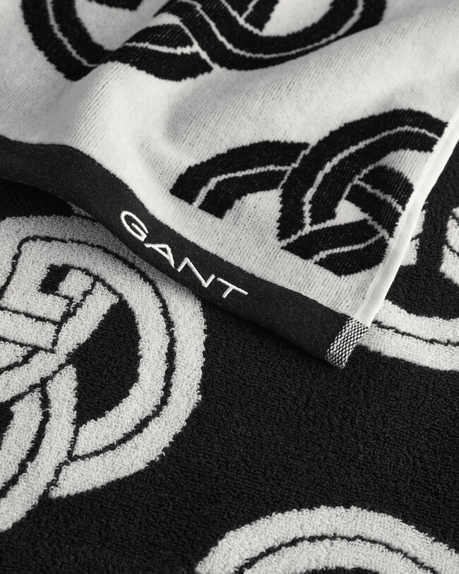 Toalha de praia com estampado Monogram