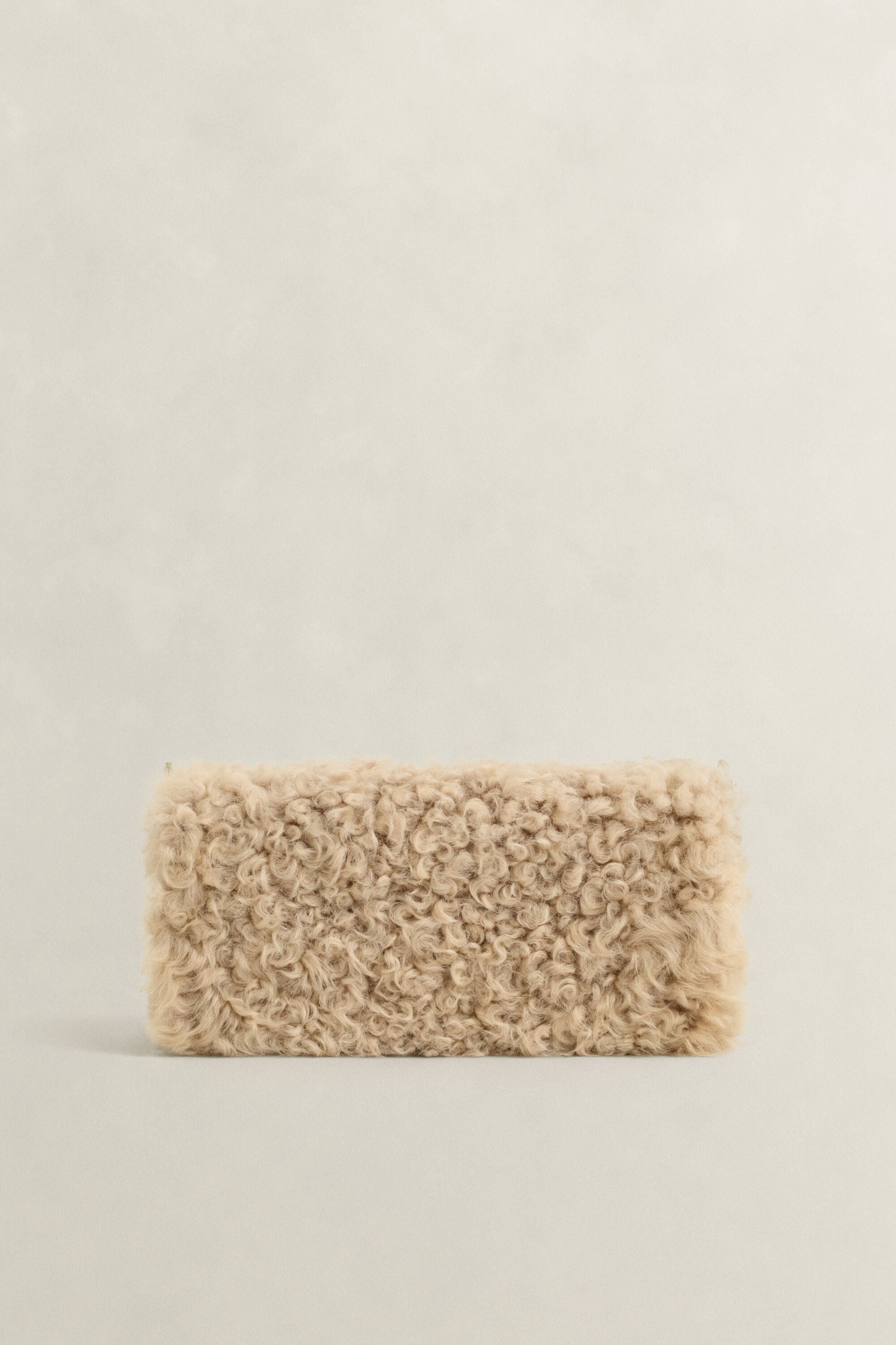 Clutch em lã de carneiro