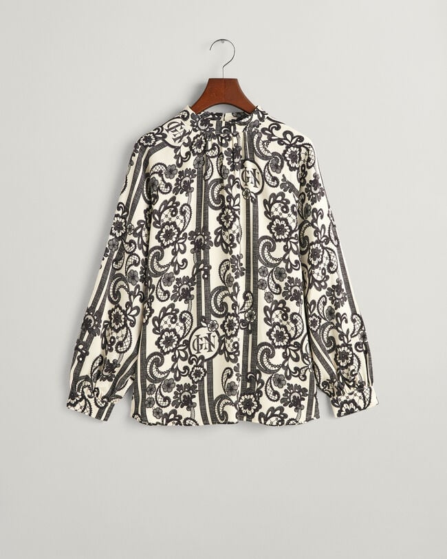 Blusa de gola alta com estampado de renda