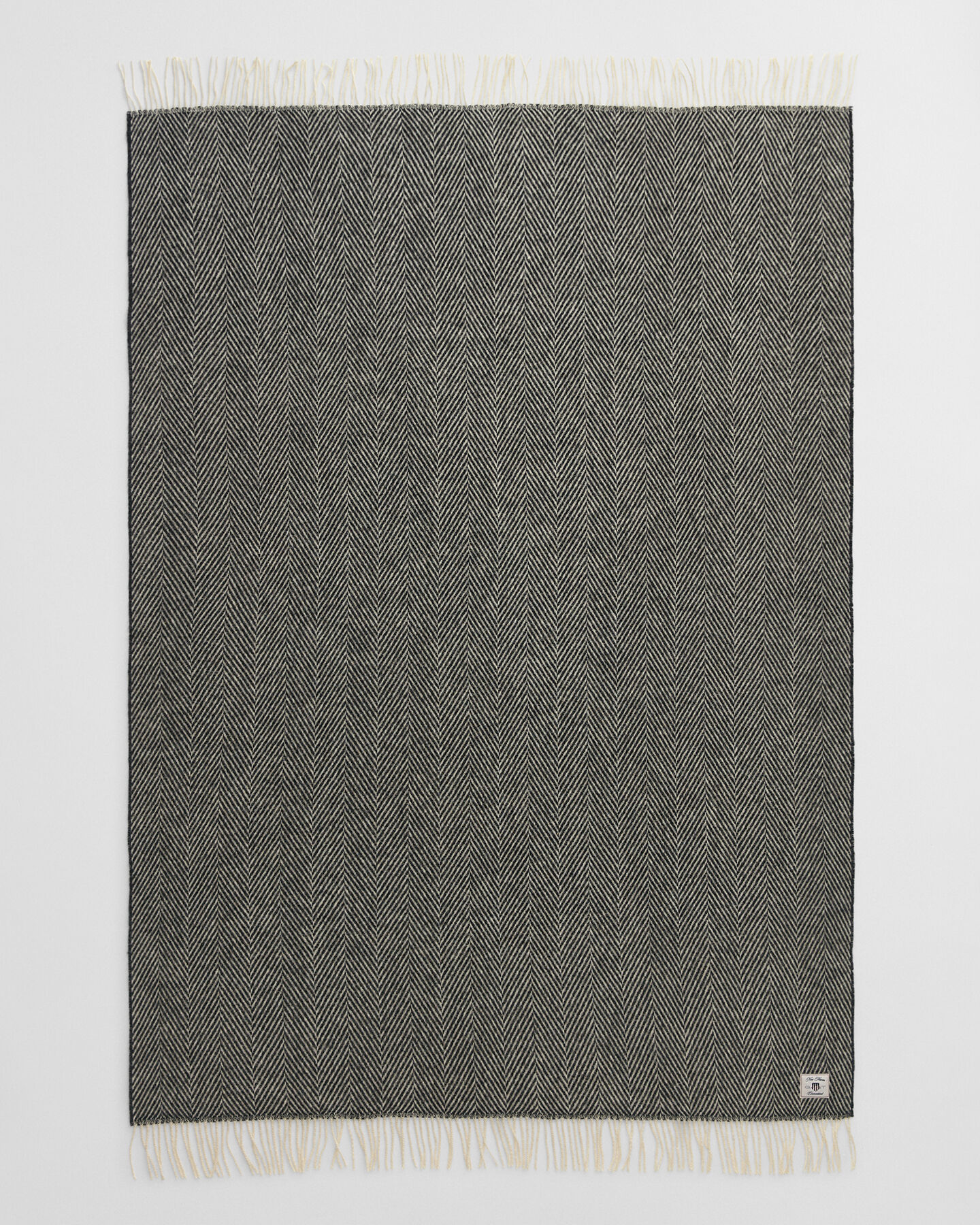 Manta decorativa em lã com padrão espinha de peixe