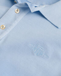 Polo em algod&atilde;o piqu&eacute; com tingimento com spray