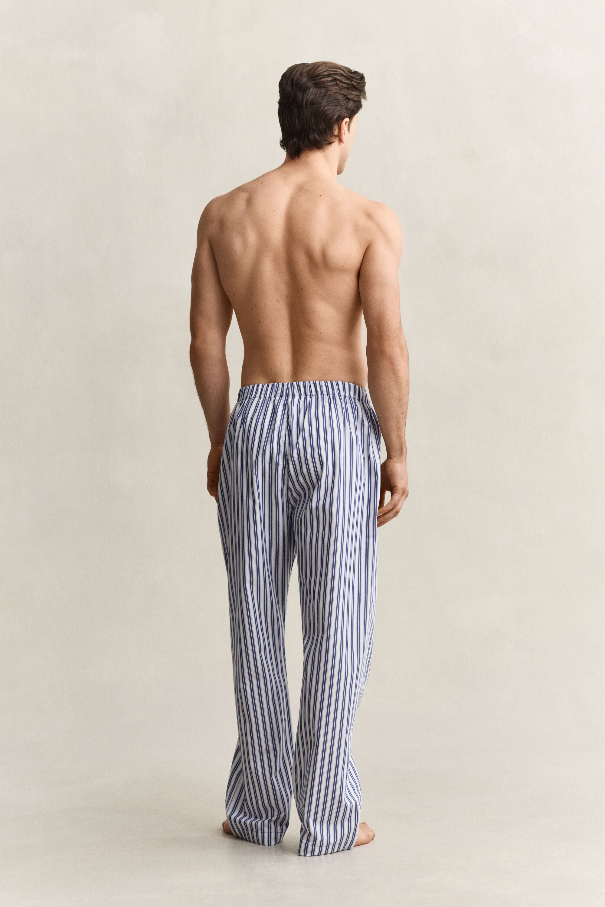 Calças de pijama às riscas