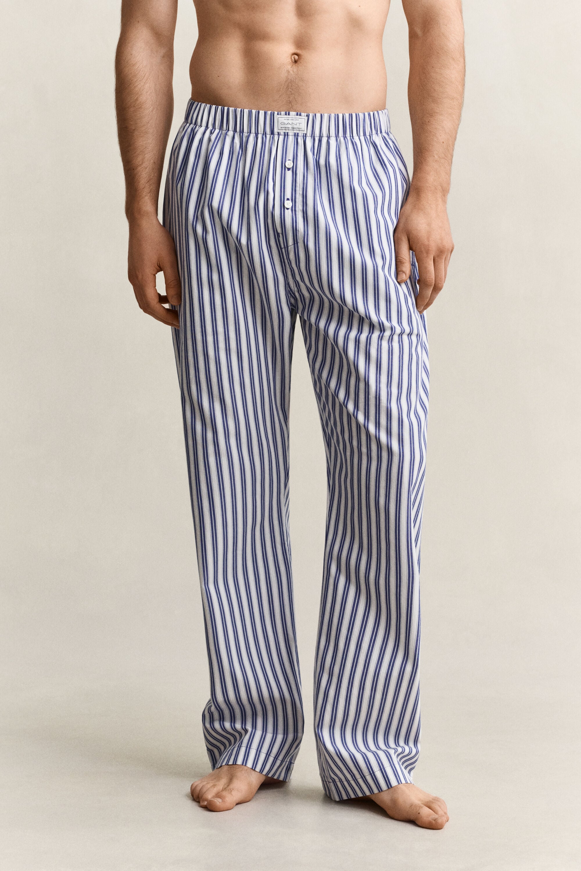 Calças de pijama às riscas