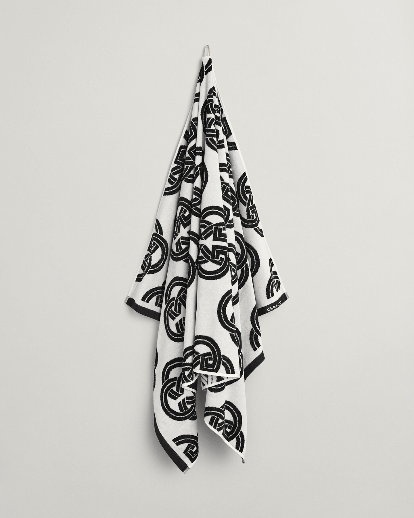 Toalha de praia com estampado Monogram