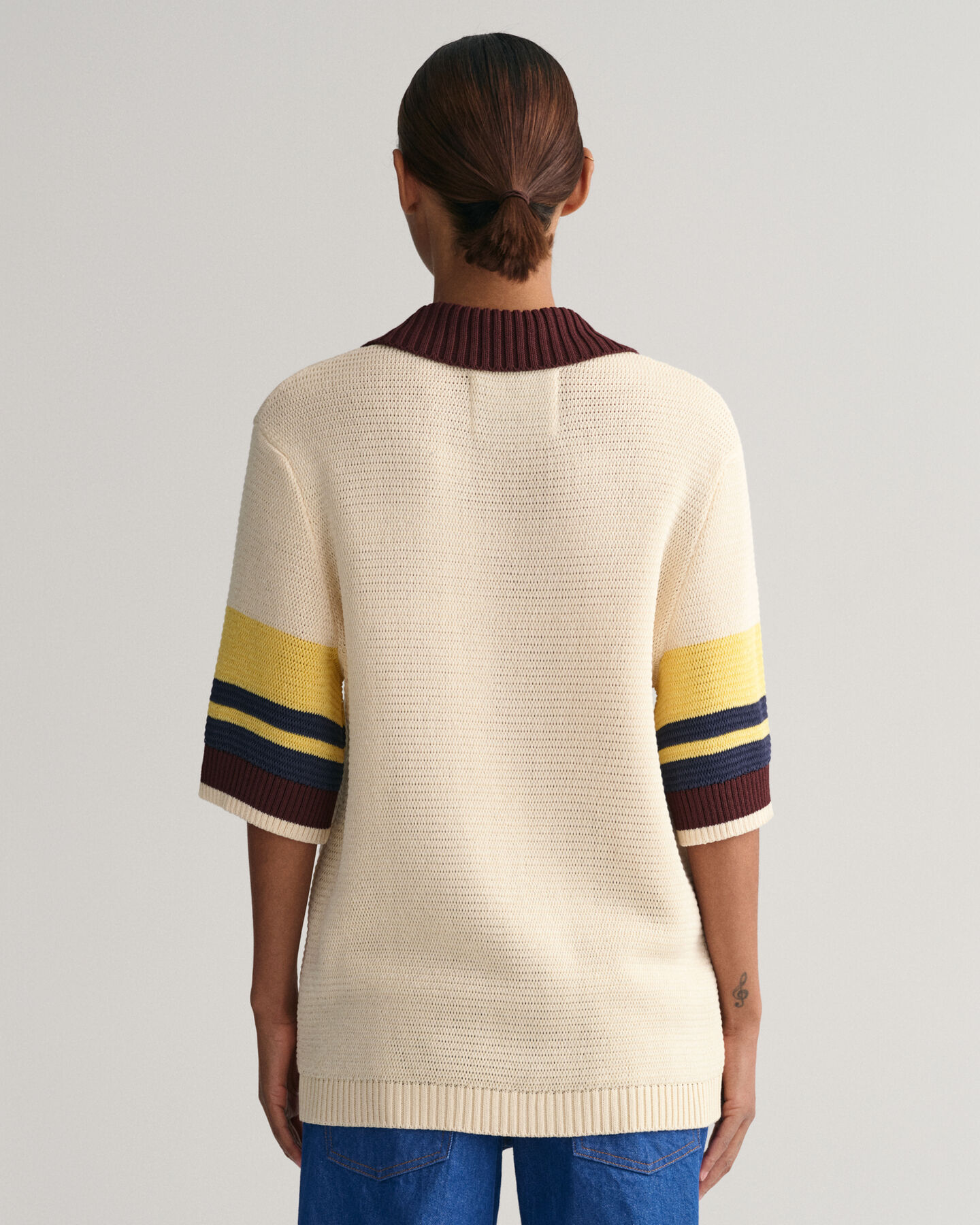 Polo em malha às riscas