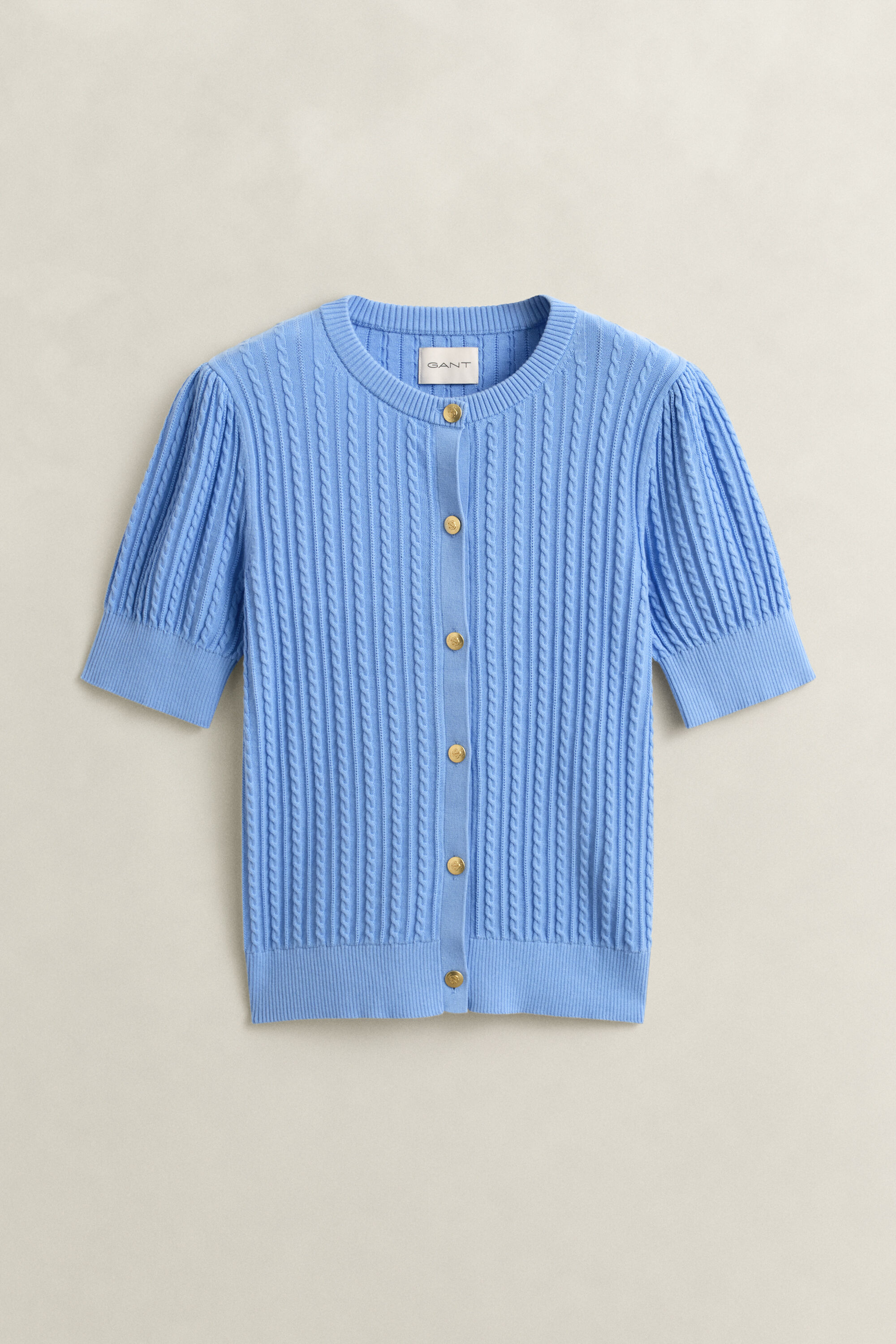 Casaco de malha entrançada em algodão